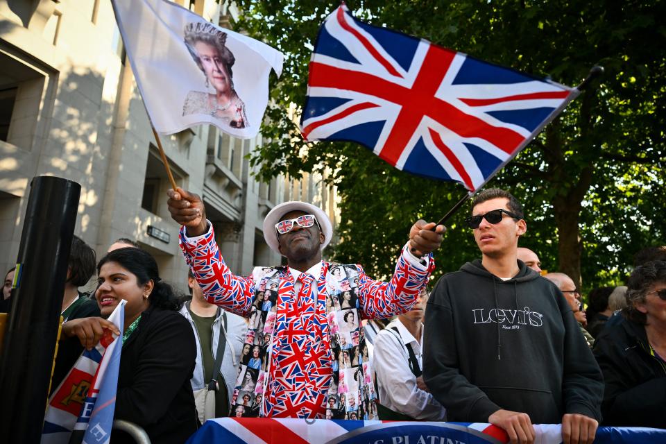 One person waved a flag bearing the Queen (Getty Images)