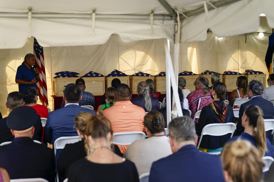 Russell Eagle Bear, a Rosebud Sioux tribal official, left, speaks during a ceremony at the U.S. Army's Carlisle Barracks, in Carlisle, Pa., Wednesday, July 14, 2021. The disinterred remains of nine Native American children who died more than a century ago while attending a government-run school in Pennsylvania were headed home to Rosebud Sioux tribal lands in South Dakota on Wednesday after a ceremony returning them to relatives. (AP Photo/Matt Rourke)