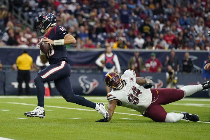 Houston Texans quarterback Davis Mills (10) runs for a touchdown past Washington Commanders defensive tackle Daron Payne (94) during the second half of an NFL football game Sunday, Nov. 20, 2022, in Houston. (AP Photo/Eric Christian Smith)