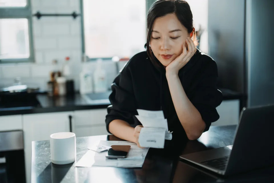 woman going over her finances at home