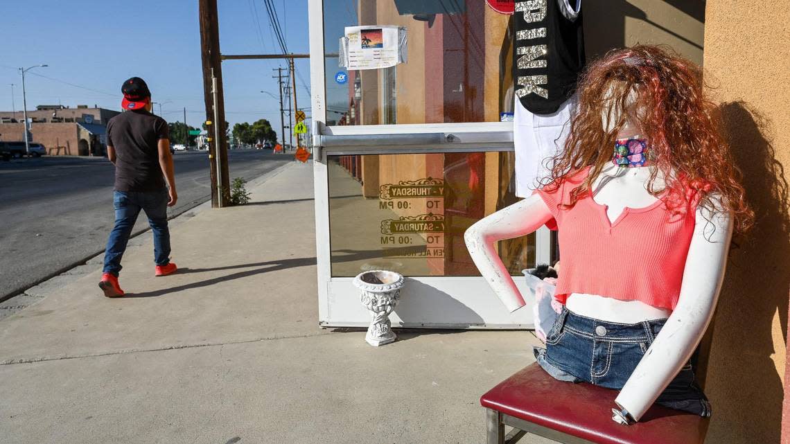 A mannequin stands outside a thrift shop on Lassen Avenue in Huron where Nohemi Ramirez works to make ends meet while the recent drought keeps her from finding work in the fields.