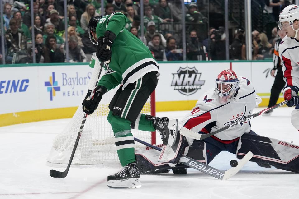 Dallas Stars center Tyler Seguin (91) has his shot blocked by Washington Capitals goaltender Vitek Vanecek (41) in the first period of an NHL hockey game in Dallas, Friday, Jan. 28, 2022. (AP Photo/Tony Gutierrez)