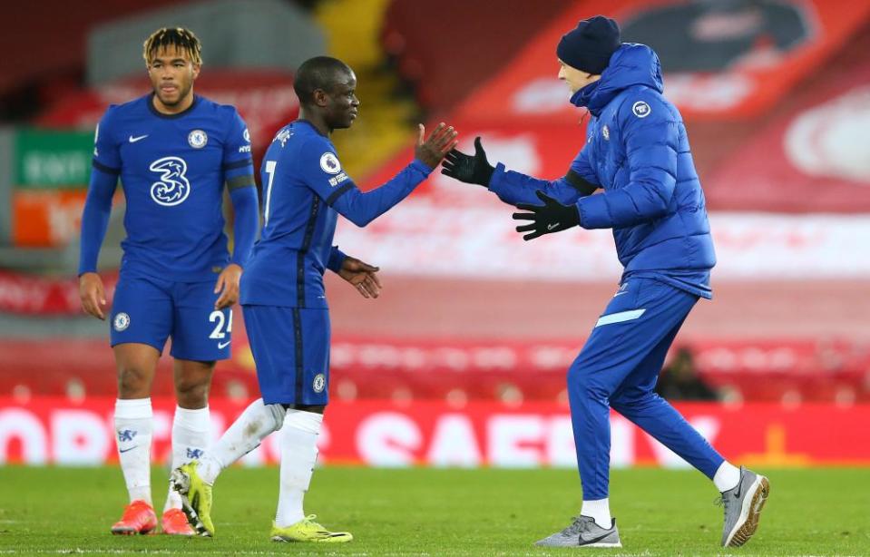 Chelsea’s manager Thomas Tuchel celebrates with N’Golo Kanté at Liverpool.