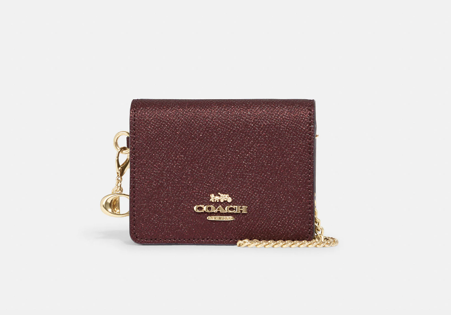 Boxed Mini Wallet On A Chain in black cherry (Photo via Coach Outlet)