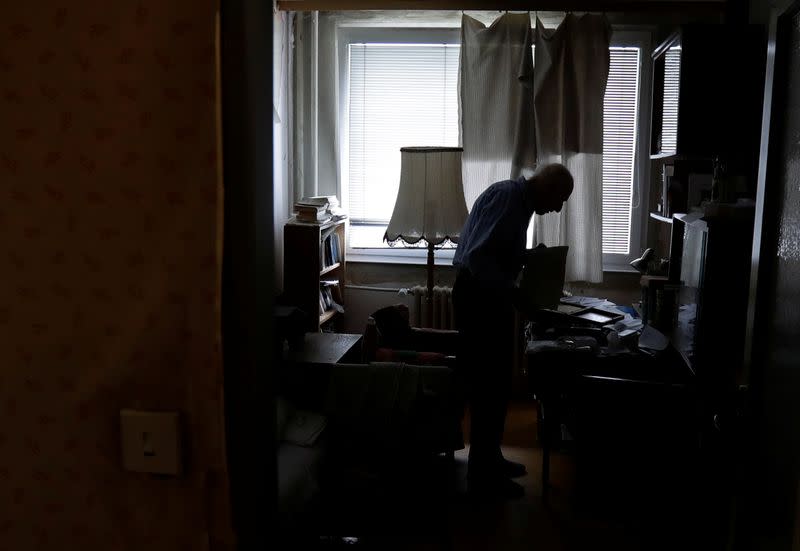 Petr Brandejsky, a 90-year-old Holocaust survivor, stands at his apartment in Prague