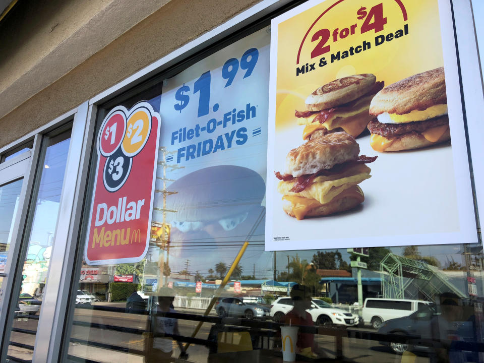 Dollar Menu advertisements are seen outside a McDonald's restaurant in Venice, California, April 29, 2018. REUTERS/Lisa Baertlein