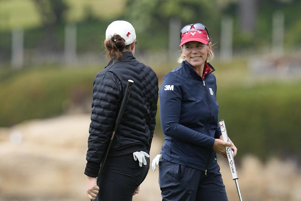 CORRECTS DAY AND DATE - Annika Sorenstam, right, of Sweden, talks with Therese Warner on the 18th green during a practice round for the U.S. Women's Open golf tournament at the Pebble Beach Golf Links, Tuesday, July 4, 2023, in Pebble Beach, Calif. (AP Photo/Darron Cummings)