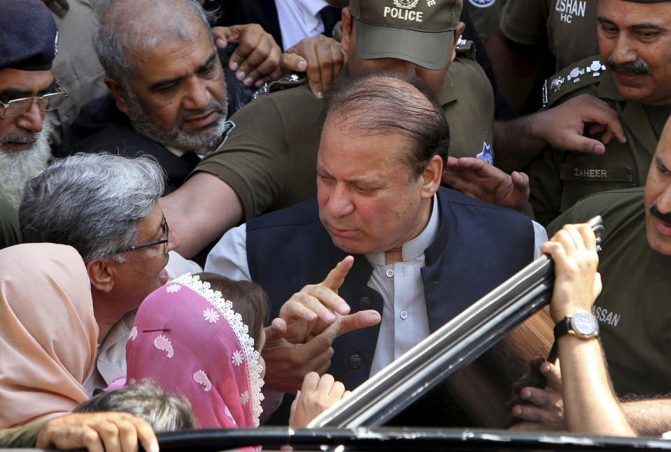 FILE - In this Friday, Oct. 11, 2019 file photo Pakistani former Prime Minister Nawaz Sharif arrives at a court in Lahore, Pakistan. The family of Pakistan's convicted former Prime Minister Nawaz Sharif says a court in the eastern city of Lahore has ordered his release on bail so he can seek medical treatment. (AP Photo/K.M. Chaudary,file)