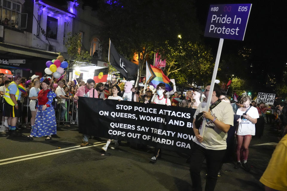 Participants march in the 45th Anniversary Sydney Gay and Lesbian Mardi Gras Parade in Oxford Street, Sydney, Australia, Saturday, Feb. 25, 2023. Organizers of the Sydney Gay and Lesbian Mardi Gras have asked police not to march at their annual parade at the weekend due to an alleged murder of a couple by a police officer, prompting the police commissioner on Tuesday, Feb, 27, 2024, to urge the ban be reversed.(AP Photo/Mark Baker)