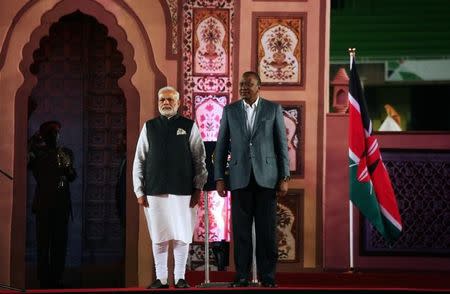 Indian Prime Minister Narendra Modi (L) and Kenya's President Uhuru Kenyatta arrive for a meeting with Indians living in Kenya, in Nairobi, July 10, 2016. REUTERS/Gregory Olando