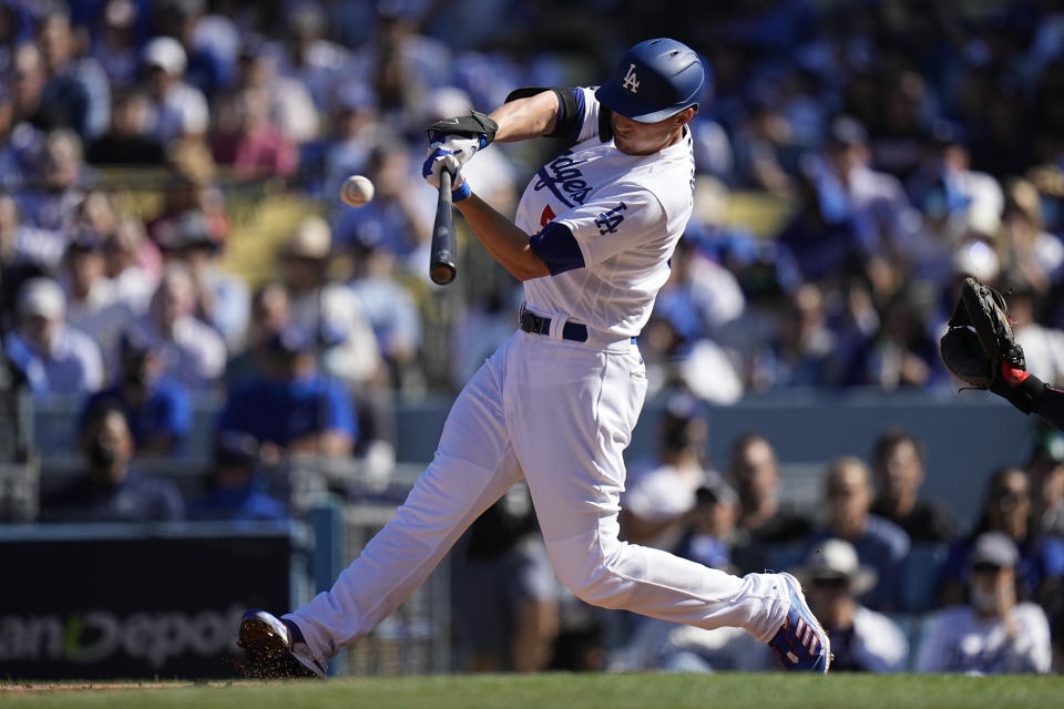 Los Angeles Dodgers' Corey Seager hits a two-run home run in the first inning against the Atlanta Braves in Game 3 of baseball's National League Championship Series Tuesday, Oct. 19, 2021, in Los Angeles. (AP Photo/Jae Hong)