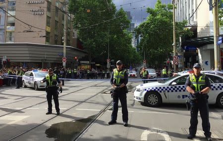 Policemen block members of the public from walking towards the Bourke Street mall in central Melbourne, Australia, November 9, 2018. REUTERS/Sonali Paul