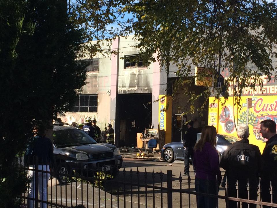 Oakland, California, firefighters inspect a warehouse on December 3, 2016, where a fire during a rave party killed 9 people on December 2. Nine people were killed and 25 missing after a huge blaze broke out during a rave party near San Francisco held in a cluttered, maze-like warehouse for artists, known as 'Oakland Ghostship,' fire officials said Saturday. / AFP / Virginie GOUBIER        (Photo credit should read VIRGINIE GOUBIER/AFP/Getty Images)