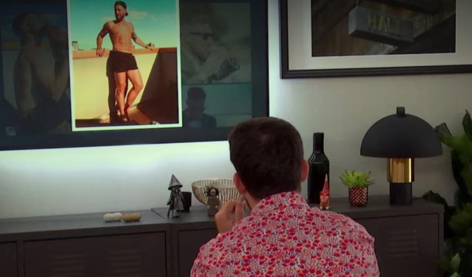 Alex wondering if he should use a picture of Eddie in short shorts. (Photo: Netflix)