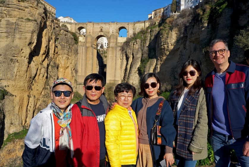 Charlie Gu, lar left, and his husband, Thomas Alfieri, far right, pose with Gu's parents and cousin on vacation in Ronda, Spain. Gu, who lives in San Francisco, uses WeChat to keep in touch with his family abroad and organize vacations. (Courtesy of Charlie Gu)