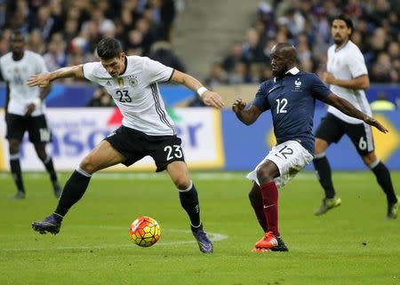 Football Soccer - France v Germany - International Friendly match - Stade de France, 13/11/15 Germany's Mario Gomez in action with France's Lassana Diarra. REUTERS/Gonzalo Fuentes