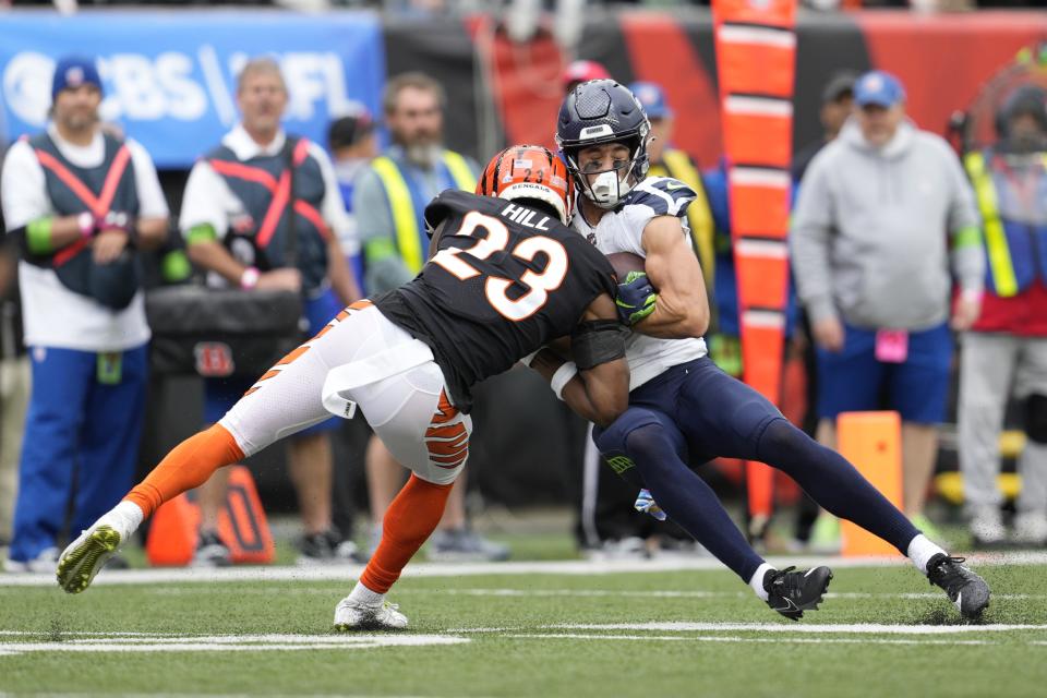 Cincinnati Bengals' Dax Hill (23) is called for unnecessary roughness against Seattle Seahawks' Jake Bobo (19) during the second half of an NFL football game, Sunday, Oct. 15, 2023, in Cincinnati. (AP Photo/Jeff Dean)