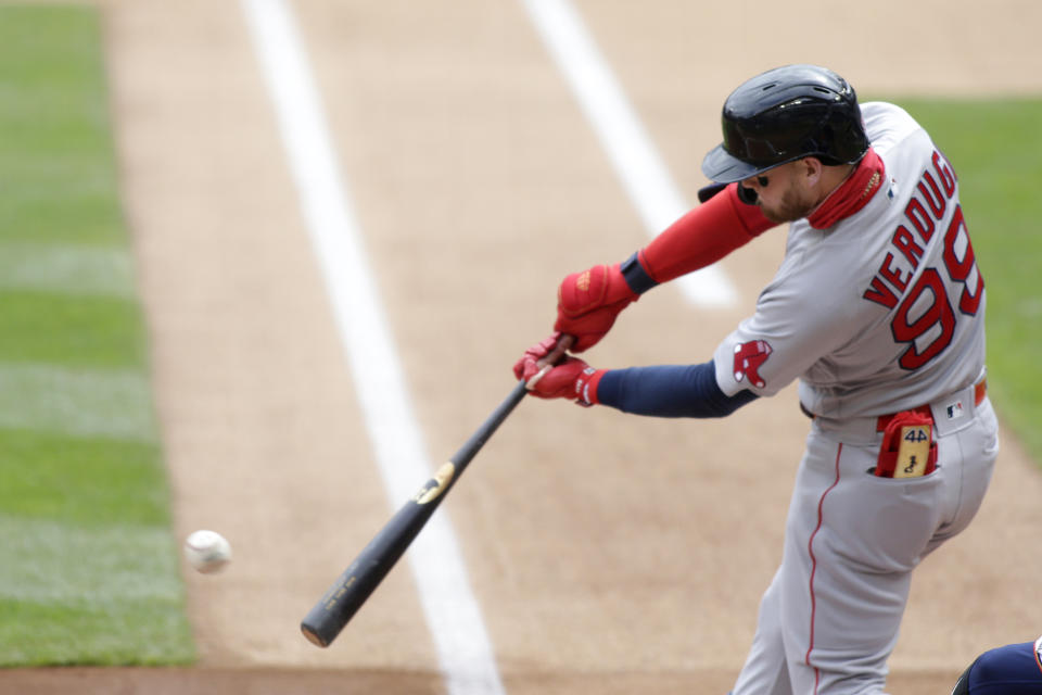 Boston Red Sox center fielder Alex Verdugo hits a single against the Minnesota Twins in the first inning during a baseball game, Wednesday, April 14, 2021, in Minneapolis. (AP Photo/Andy Clayton-King)