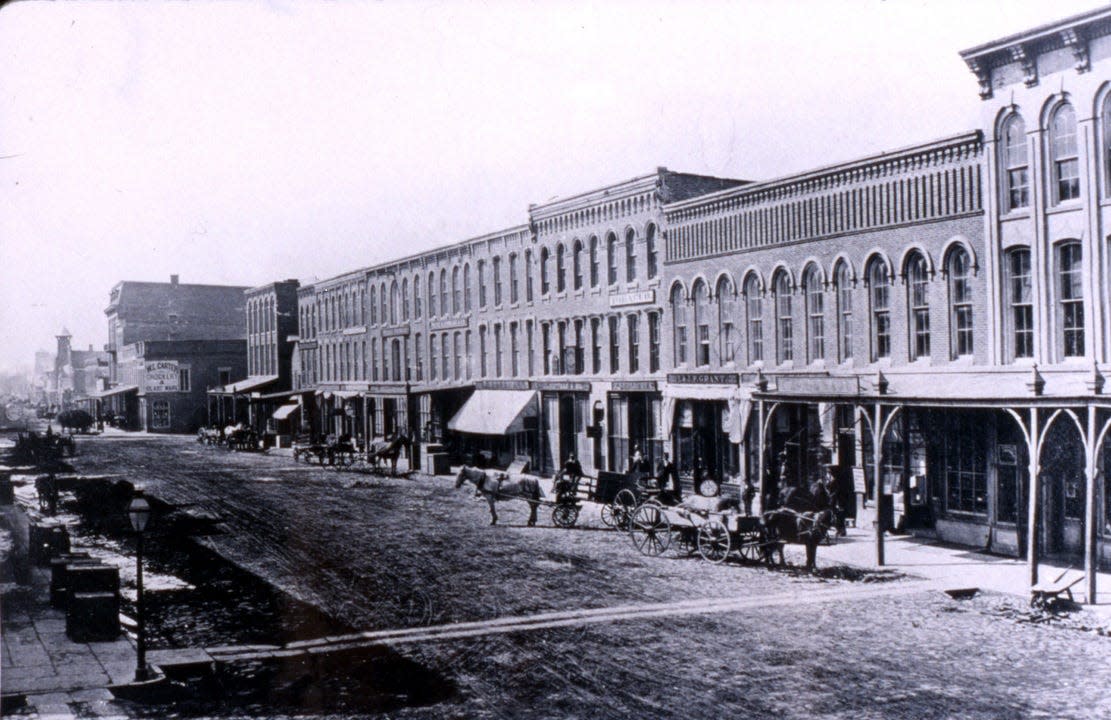 This picture shows Front Street in Monroe as it appeared in 1880. The street was aptly named for its location near the River Raisin and at the beginning of the Old Village Plat area.