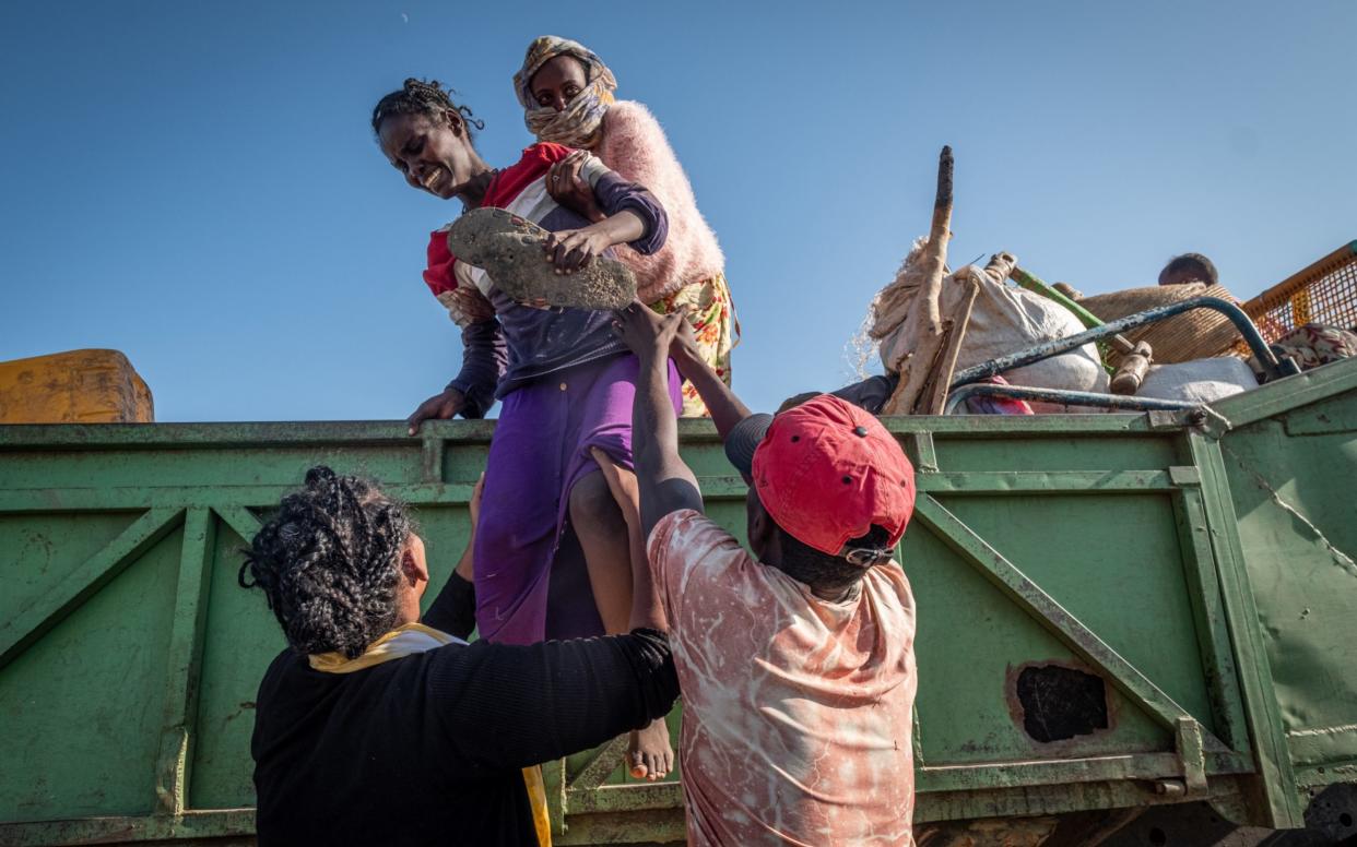 An Ethiopian woman cries as she arrives in a refugee camp in Sudan, fleeing the horrendous civil war at the other side of the border. - Joost Bastmeijer for the Telegraph