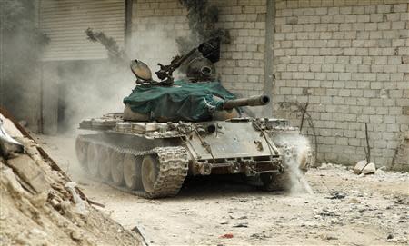 A military vehicle that belongs to the Free Syrian Army is seen in Al-Amariya district in Aleppo May 8, 2014. REUTERS/Ammar Abdullah