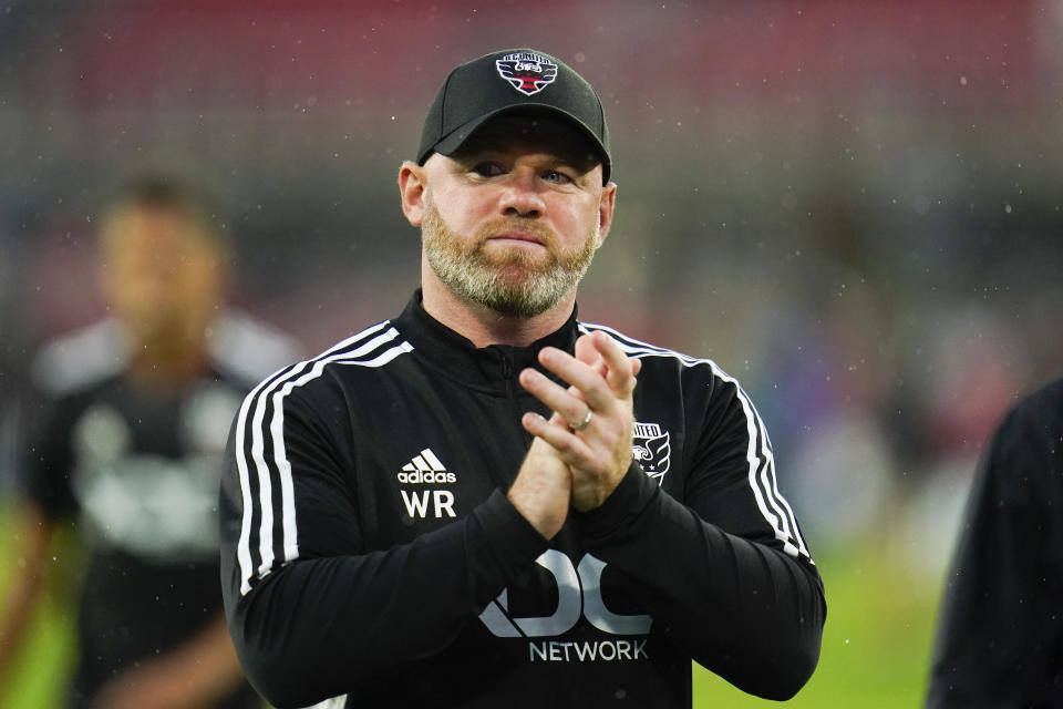 D.C. United head coach Wayne Rooney reacts after an MLS soccer match against Orlando City, Sunday, July 31, 2022, in Washington. D.C. United won 2-1. (AP Photo/Julio Cortez)