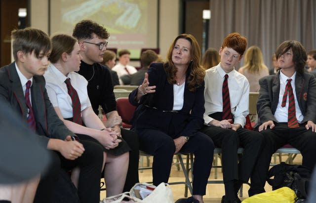 Education Secretary Gillian Keegan during a mock election event at Chichester Free School, surrounded by students in uniform