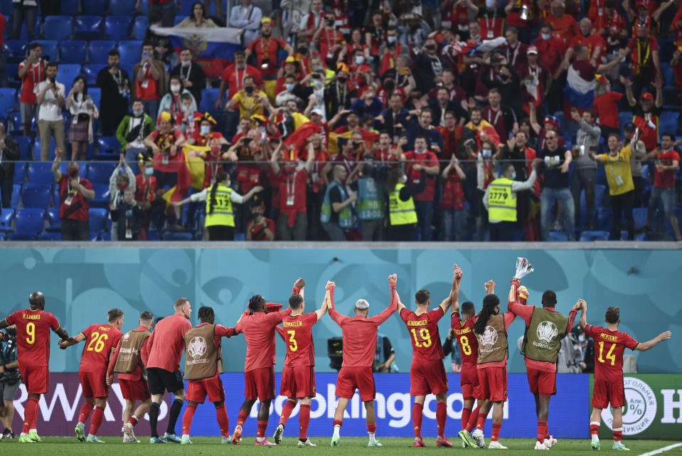 Belgium's players and their fans react after the Euro 2020 soccer championship group B match between Russia and Belgium at Gazprom arena stadium in St. Petersburg, Russia, Saturday, June 12, 2021. (AP Photo/Kirill Kudryavtsev, Pool)