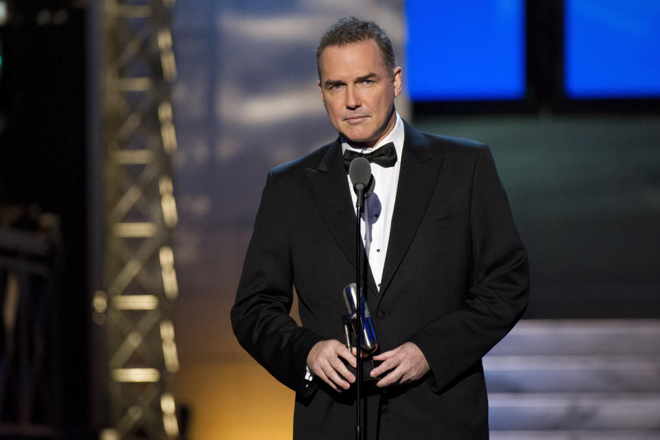 FILE - Comedian-actor Norm Macdonald appears onstage at The 2012 Comedy Awards in New York on April 28, 2012. Macdonald, a comedian and former cast member on "Saturday Night Live," died Tuesday, Sept. 14, 2021, after a nine-year battle with cancer that he kept private, according to Brillstein Entertainment Partners, his management firm in Los Angeles. He was 61. (AP Photo/Charles Sykes, File)