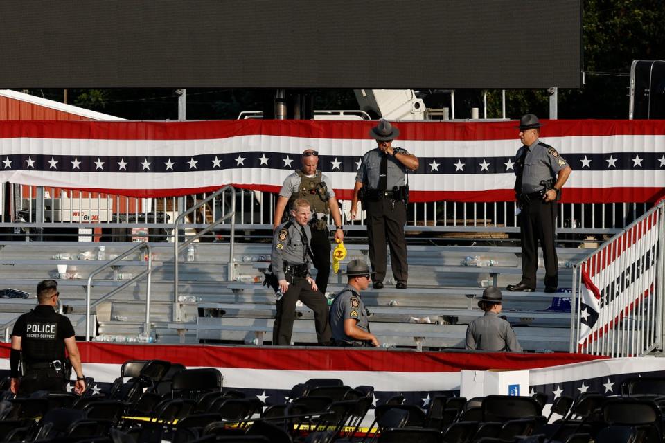 Law enforcement agents stand at the Butler, Pennsylvania rally site where Thomas Matthew Crooks opened fire, injuring two attendees and killing one (Getty Images)