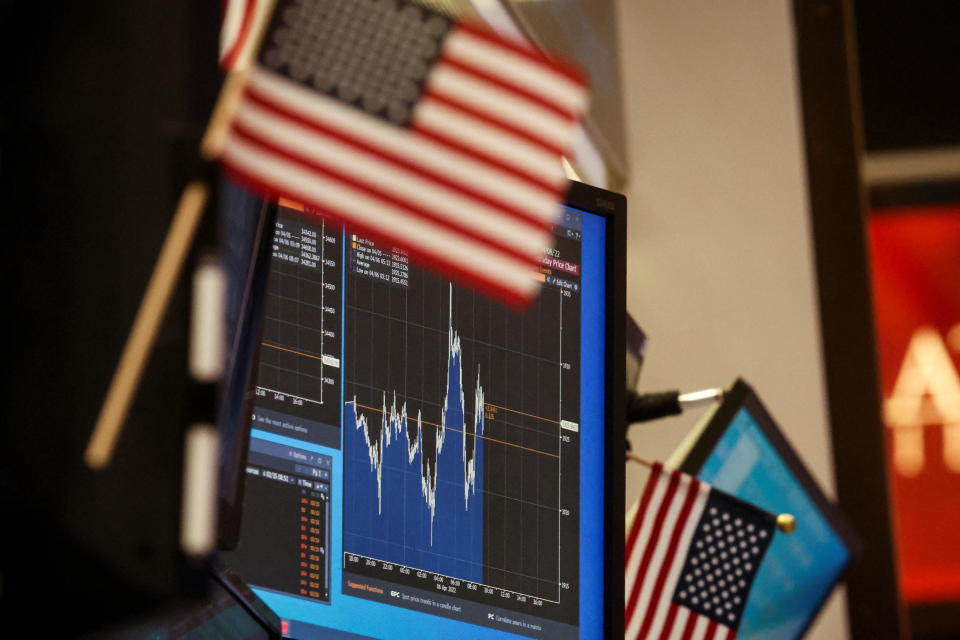 A screen displays a stock chart at a work station on the floor of the New York Stock Exchange (NYSE) in New York City, U.S., April 6, 2022. REUTERS/Brendan McDermid