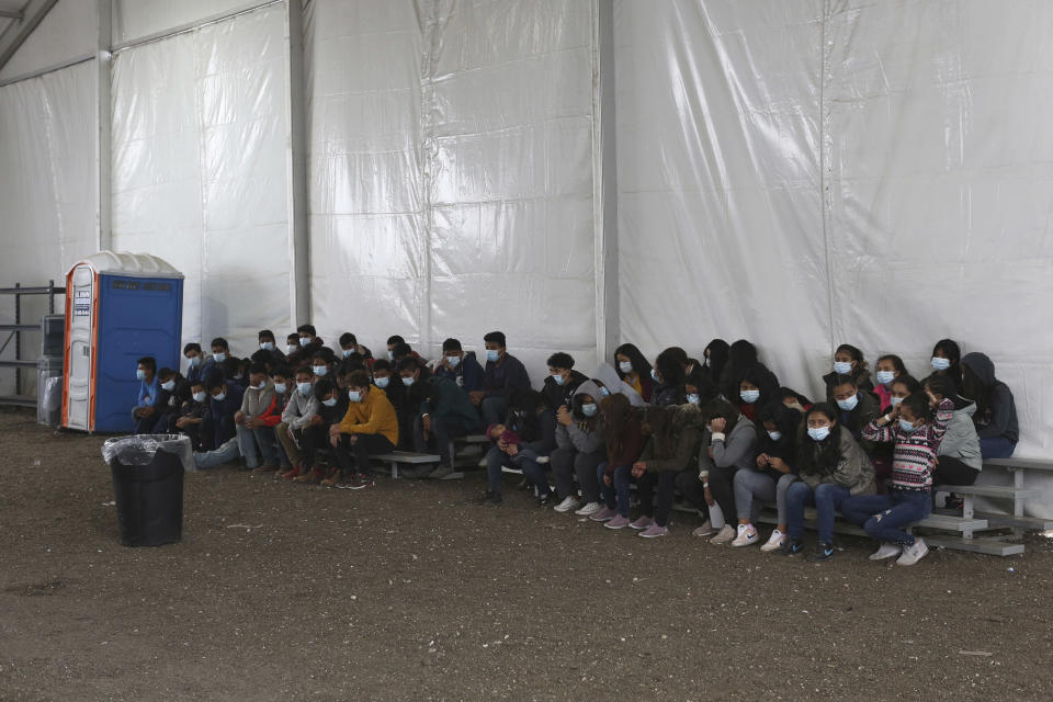 Newly migrants wait to enter the intake area at the Donna Processing Center, run by the Customs and Border Patrol (CBP), the main detention center for unaccompanied children in the Rio Grande Valley in Donna, Texas on March 30, 2021. / Credit: DARIO LOPEZ-MILLS/POOL/AFP via Getty Images