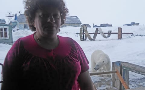 Meteorologist Lyudmila Maksimova takes a selfie with a polar bear - Credit: Lyudmila Maksimova