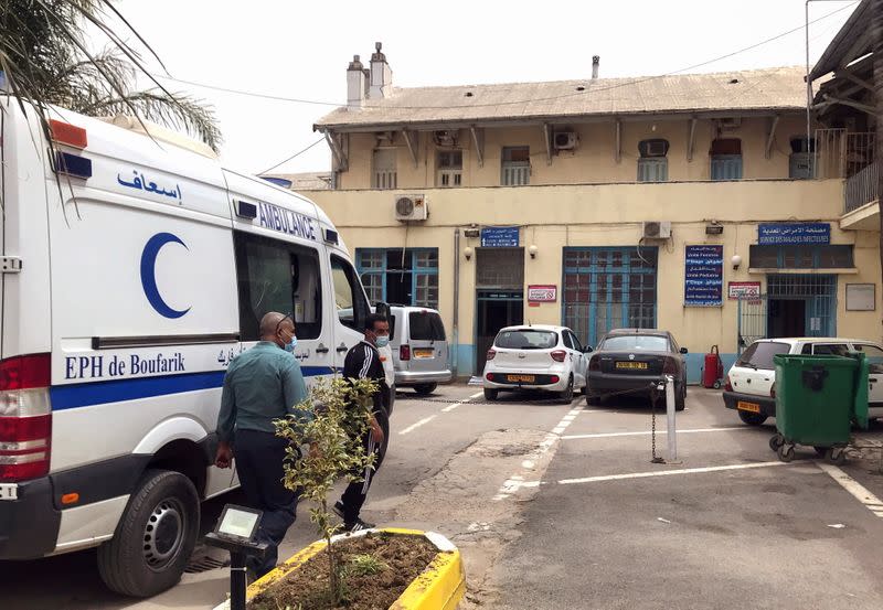 An ambulance is parked outside the infectious diseases department at Boufarik Hospital