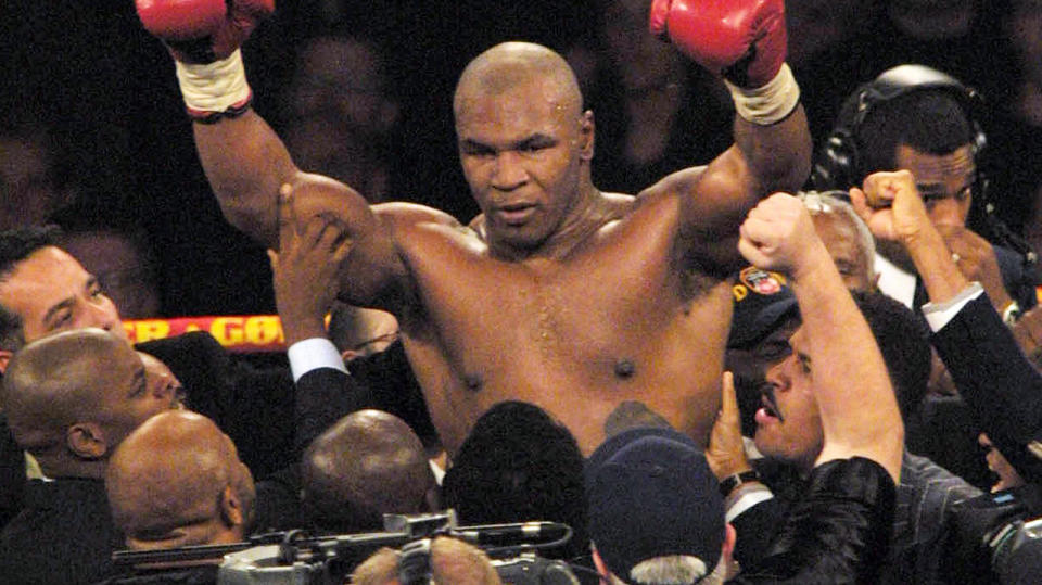 Mike Tyson, pictured here celebrating after victory over Dane Brian Nielsen in 2001.