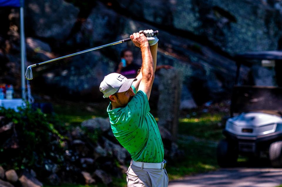 Kyle Pelletier tracks his shot from the tee on Hole Seven at the Fourball Tournament hosted by Country Club of New Bedford.