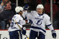 NEWARK, NJ - FEBRUARY 26: Martin St. Louis #26 (L)of the Tampa Bay Lightning scores at 6:39 of the second period against the New Jersey Devils and is joined by Steven Stamkos #91 (R) at the Prudential Center on February 26, 2012 in Newark, New Jersey. (Photo by Bruce Bennett/Getty Images)