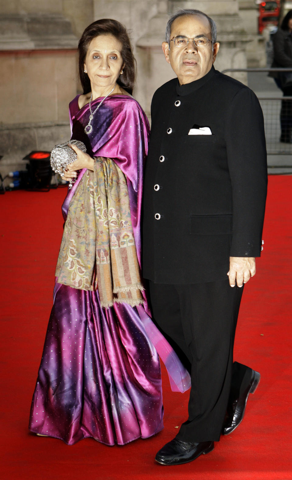 FILE - In this Thursday, April 15, 2010 file photo, Gopichand Hinduja and guest arrive for the private viewing of the exhibition 'Grace Kelly: Style Icon', at the Victoria & Albert Museum in London. A new study of the super-rich finds that London has become the capital of the world's wealthiest, with more billionaires than any other city in the world. Indian-born brothers Srichand and Gopichand Hinduja top the list, with a 11.9-billion pound fortune. The two run the Hinduja Group conglomerate. (AP Photo/Joel Ryan, File)