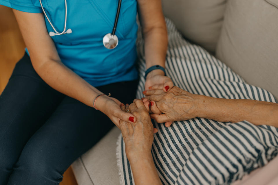 Doctor holding patients's hands