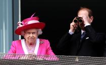 FILE PHOTO: Britain's Queen Elizabeth and Prince Edward watch the winners enclosure after her horse lost in the Epsom Derby at Epsom Racecourse in southern England