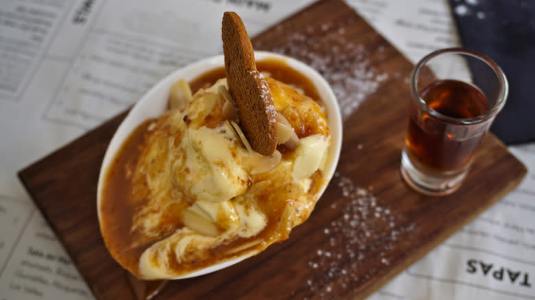 Spanish version of Bienmesabe custard with cookie garnish 