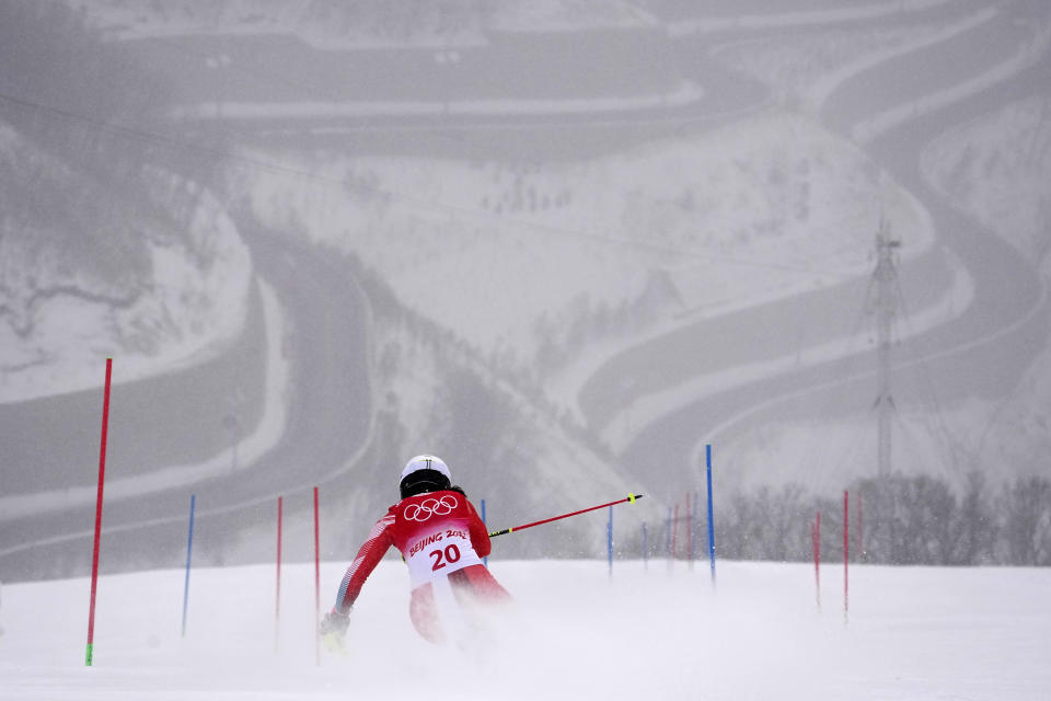 FILE - Wendy Holdener of Switzerland passes a gate during the women's combined slalom at the 2022 Winter Olympics, Thursday, Feb. 17, 2022, in the Yanqing district of Beijing. The dearth of candidates to host the Winter Olympics amid spiraling venue costs could force the IOC to resort to lining up a list of fixed, rotating hosts. A highly theoretical list could include Salt Lake City and Vancouver in North America, Pyeongchang in Asia and places like Switzerland, Italy and Scandinavia in Europe. (AP Photo/Robert F. Bukaty, File)