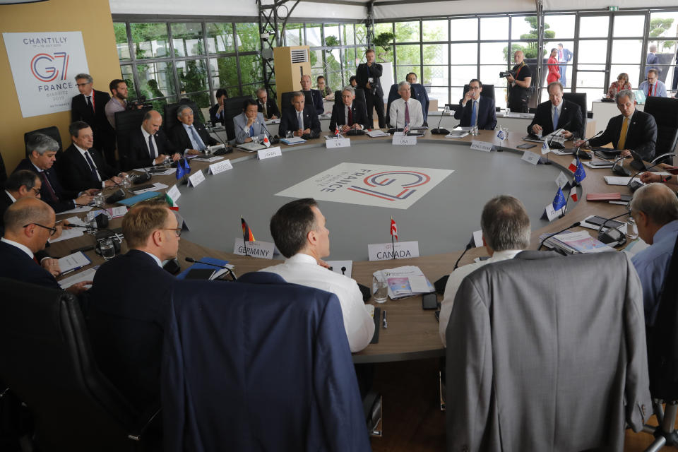 Finance ministers and banks governors attend a session at the G-7 Finance Wednesday July 17, 2019 in Chantilly, north of Paris. The Trump administration is objecting to France's plan to tax Facebook, Google and other U.S. tech giants, a rift that's overshadowing talks between seven longtime allies near Paris this week on issues ranging from digital currencies to trade. (AP Photo/Michel Euler)