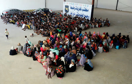 Migrants are seen in a shelter after they were relocated from government-run detention centers, after getting trapped by clashes between rival groups in Tripoli, Libya August 30, 2018. REUTERS/Hani Amara