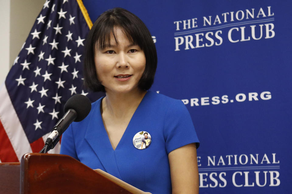 Hua Qu, the wife of Xiyue Wang, a Princeton University graduate student being held at an Iranian prison, speaks at a news conference to mark the third anniversary of her husband's imprisonment, Thursday, Aug. 8, 2019, at the National Press Club in Washington. (AP Photo/Patrick Semansky)