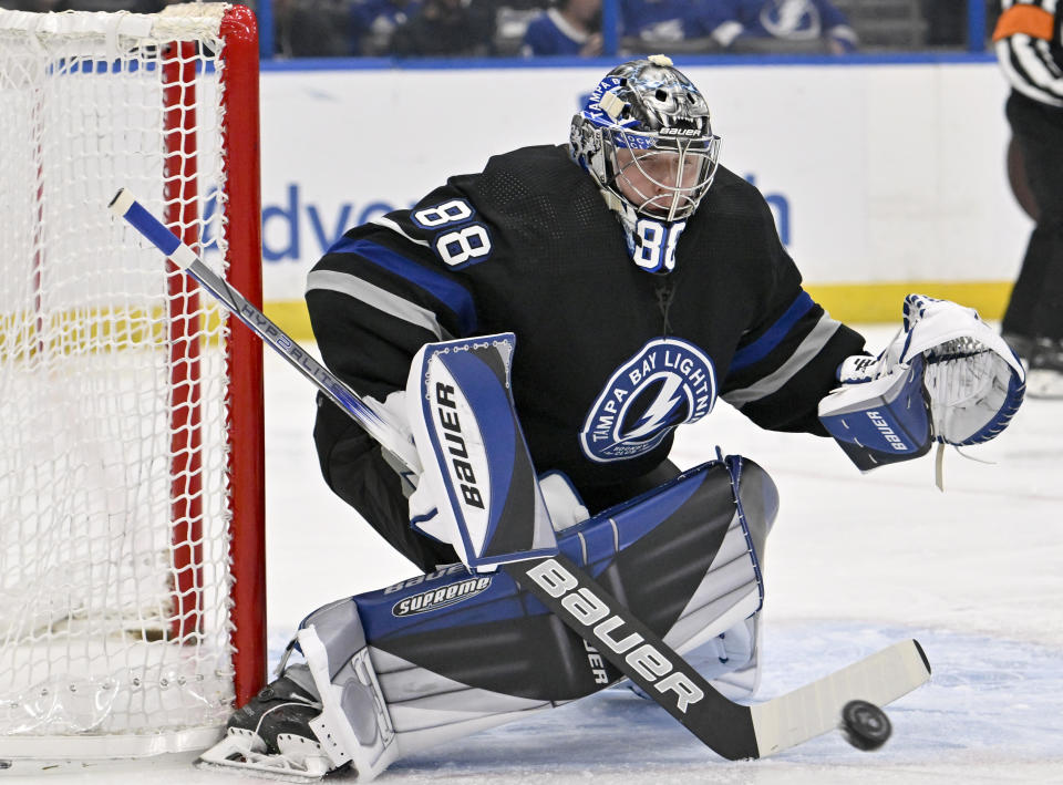 Tampa Bay Lightning goaltender Andrei Vasilevskiy (88) makes a save during the first period of an NHL hockey game against the Ottawa Senators, Monday, Feb. 19, 2024, in Tampa, Fla. (AP Photo/Jason Behnken)