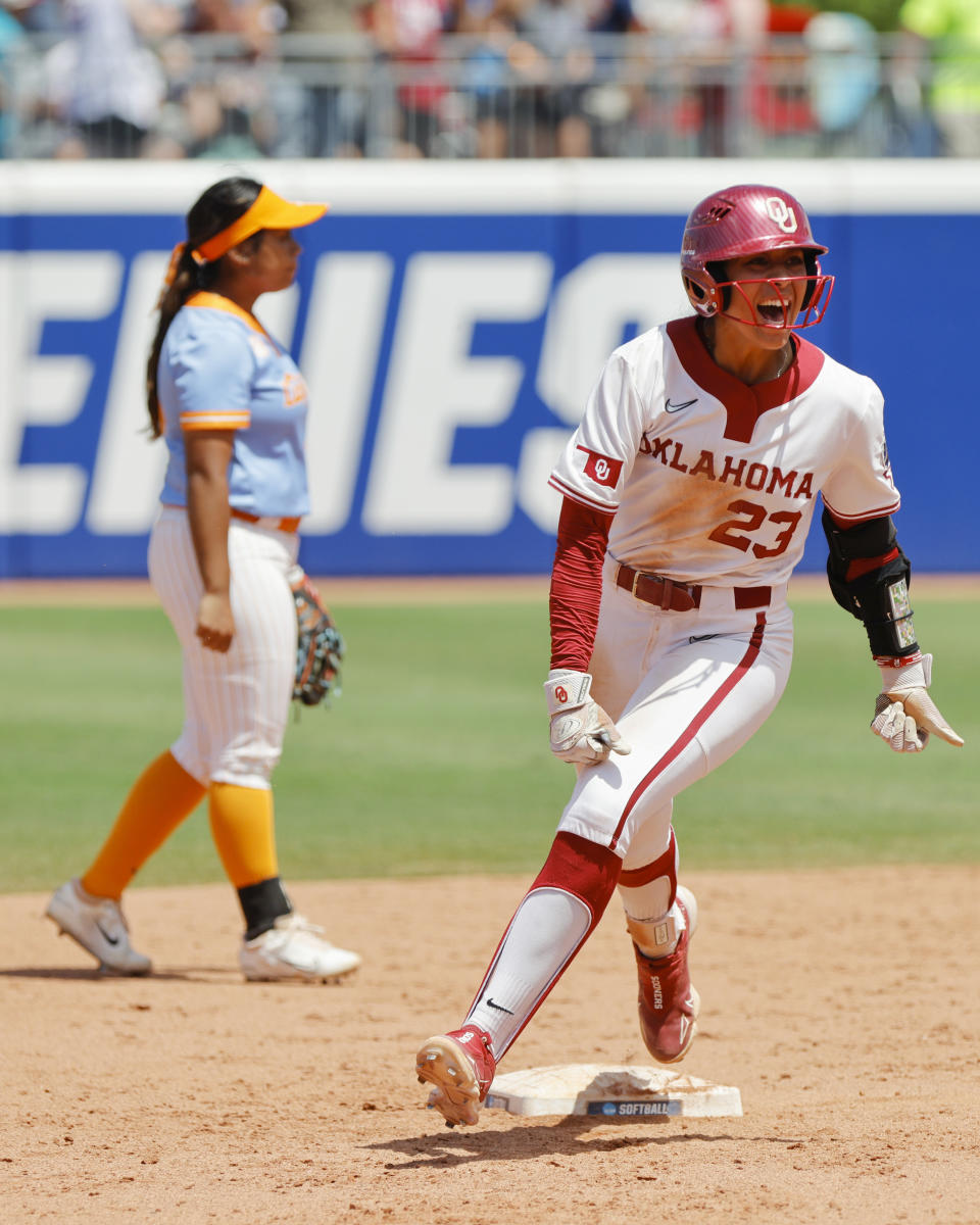 Oklahoma's Tiare Jennings (23) celebrates as she runs the bases after hitting a three-run home run against Tennessee during the second inning of an NCAA softball Women's College World Series game Saturday, June 3, 2023, in Oklahoma City. (AP Photo/Nate Billings)