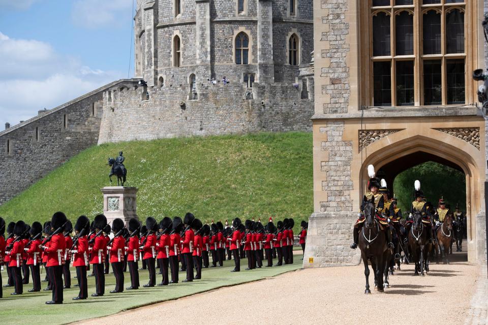 WINDSOR, ENGLAND - JUNE 12:  A general view as Queen Elizabeth II attends a military ceremony in the Quadrangle of Windsor Castle to mark her Official Birthday on June 12, 2020 at Windsor Castle on June 12, 2021 in Windsor, England. Trooping of the Colour has marked the Official Birthday of the Sovereign for over 260 years and it has been agreed once again that in line with government advice The Queen’s Birthday Parade, also known as Trooping the Colour, will not go ahead in its traditional form. This years parade is formed by soldiers who have played an integral role in the NHS’ COVID-19 response, as well as those who have been serving on military operations overseas. (Photo by Eddie Mulholland - WPA Pool/Getty Images)