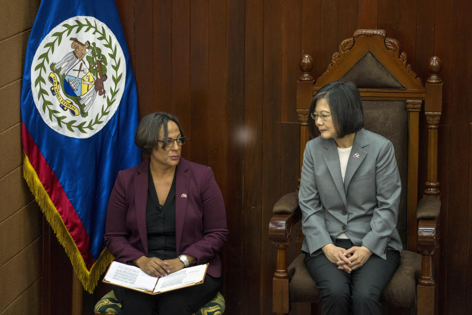 Taiwan's President Tsai Ing-wen, right, listens to Speaker of the House Valerie Woods at the National Assembly in Belmopan, Belize, Monday, April 3, 2023. Tsai is in Belize for an official three-day visit. (AP Photo/Moises Castillo)