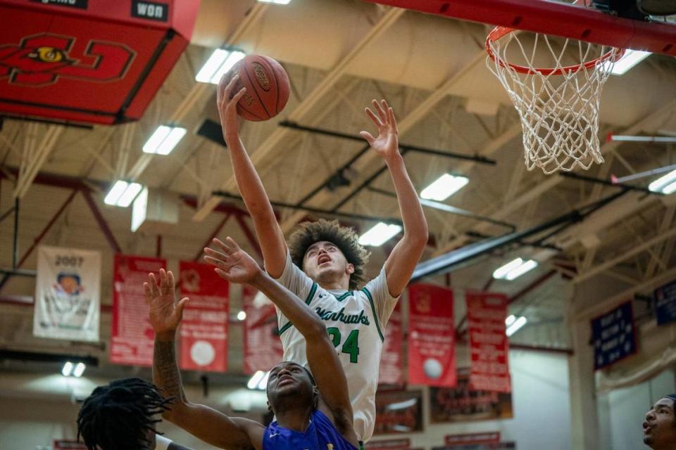 Great Crossing’s Malachi Moreno (24) grabs a rebound against Male at Scott County High School in the Dan Cummins Classic on Jan. 20 in Georgetown.